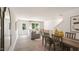 Open-concept living and dining area features a gray couch and a wooden dining table at 192 Holmes Corner Dr, Smithfield, NC 27577