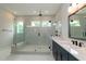 Spacious bathroom showcasing a large glass shower, white tile, and double vanity at 2 Deer Run Trl, Hillsborough, NC 27278