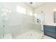 Luxurious bathroom with a large glass shower and white counters sitting on a blue vanity at 2 Deer Run Trl, Hillsborough, NC 27278