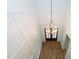 Elevated view of the foyer with a modern chandelier and hardwood floors at 2 Deer Run Trl, Hillsborough, NC 27278