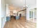 Spacious kitchen with white cabinets and a large center island, designed for both cooking and gathering at 2 Deer Run Trl, Hillsborough, NC 27278