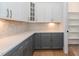Kitchen with modern cabinets, sleek countertops, and stylish backsplash, combines functionality with modern design at 2 Deer Run Trl, Hillsborough, NC 27278
