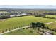 Scenic land with bales of hay, a pond, road access, and lush trees, offering countryside charm at 2 Deer Run Trl, Hillsborough, NC 27278