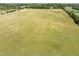 Expansive grassy land with mature trees bordering the property, offering serene country living at 2 Deer Run Trl, Hillsborough, NC 27278