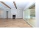 Bright living room featuring wood floors, a fireplace, and sliding glass doors, seamlessly blending indoor-outdoor living at 2 Deer Run Trl, Hillsborough, NC 27278