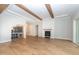 Spacious living room with wood floors, fireplace and built-in wine storage, perfect for entertaining guests at 2 Deer Run Trl, Hillsborough, NC 27278