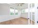 Well-lit office with hardwood floors, wainscoting, and a ceiling fan at 2 Deer Run Trl, Hillsborough, NC 27278