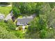 An aerial view of a house with lush landscaping and a tree-lined perimeter at 2008 Elizabeth Ct, Clayton, NC 27520