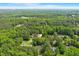 Aerial view of property surrounded by mature trees creating a private setting at 2008 Elizabeth Ct, Clayton, NC 27520