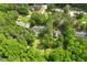 Aerial view showcasing the home's surroundings with mature trees at 2008 Elizabeth Ct, Clayton, NC 27520