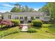 Well-maintained backyard with deck and mature landscaping at 2008 Elizabeth Ct, Clayton, NC 27520