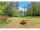 Expansive backyard with fire pit and home in background at 2008 Elizabeth Ct, Clayton, NC 27520