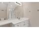 Bathroom featuring a large mirror, a single sink, and a glass door shower at 2008 Elizabeth Ct, Clayton, NC 27520