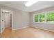 Bedroom with hardwood floors and a walk-in closet with built in shelving at 2008 Elizabeth Ct, Clayton, NC 27520