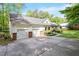 Spacious driveway with two-car garage and well-maintained landscaping at 2008 Elizabeth Ct, Clayton, NC 27520