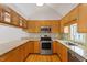 Well-equipped kitchen features stainless steel appliances, granite countertops, and wooden cabinetry at 2008 Elizabeth Ct, Clayton, NC 27520