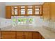 Granite countertops and backyard views are featured in this stunning kitchen at 2008 Elizabeth Ct, Clayton, NC 27520