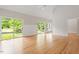Bright living room with hardwood floors and sliding glass doors at 2008 Elizabeth Ct, Clayton, NC 27520