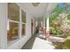 Charming covered porch with brick columns and wooded views at 2008 Elizabeth Ct, Clayton, NC 27520