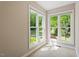 Bright sunroom with natural light shining through the windows and showing a view of the backyard at 2008 Elizabeth Ct, Clayton, NC 27520