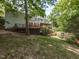 Large backyard featuring a spacious deck and screened porch, ideal for outdoor living at 204 Highlands Lake Dr. Dr, Cary, NC 27518