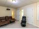 Finished basement area features neutral paint and carpet, and comfortable seating with two entrances at 204 Highlands Lake Dr. Dr, Cary, NC 27518