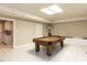 Finished basement featuring a pool table and tile flooring, great for entertaining at 204 Highlands Lake Dr. Dr, Cary, NC 27518