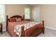 Cozy bedroom featuring natural light, a comfortable bed with floral accents, and neutral decor at 204 Highlands Lake Dr. Dr, Cary, NC 27518