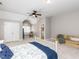 Spacious bedroom features seating, natural light, an ensuite laundry room and neutral decor at 204 Highlands Lake Dr. Dr, Cary, NC 27518