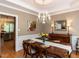Dining room with wooden table set for dinner and decorative chandelier at 204 Highlands Lake Dr. Dr, Cary, NC 27518
