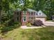 Beautiful brick two-story home with black shutters, landscaped front yard, and attached two-car garage at 204 Highlands Lake Dr. Dr, Cary, NC 27518