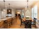 Open kitchen with breakfast bar seating that looks into the living room and sunlit eat-in area at 204 Highlands Lake Dr. Dr, Cary, NC 27518