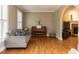 Comfortable living room with hardwood floors, a piano, and cozy seating area at 204 Highlands Lake Dr. Dr, Cary, NC 27518