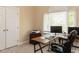 Well-lit office featuring a large window, dual monitors, a printer and ample workspace at 204 Highlands Lake Dr. Dr, Cary, NC 27518