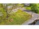 Aerial shot of a grassy lot, featuring lush greenery, and mature trees at 212 Orange St, Oxford, NC 27565