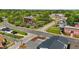 Aerial view of an urban landscape with buildings, roads, parking, and green spaces at 212 Orange St, Oxford, NC 27565