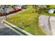 Aerial shot of a spacious lot, featuring lush greenery, and mature trees at 212 Orange St, Oxford, NC 27565