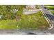 Aerial shot of a grassy lot and building featuring lush greenery, and mature trees at 212 Orange St, Oxford, NC 27565