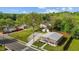 Aerial view of a charming home featuring a metal roof and lush green lawn at 212 Orange St, Oxford, NC 27565