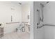 Accessible bathroom includes safety grab bars, accessible vanity and sink and a walk-in shower with handheld at 212 Orange St, Oxford, NC 27565