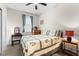 Cozy bedroom with natural light, soft carpet, and a charming decor, provides relaxation at 212 Orange St, Oxford, NC 27565