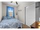 Comfortable bedroom features soft carpet, closet space and bright natural light from the window at 212 Orange St, Oxford, NC 27565