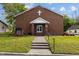 Exterior shot of a charming church building with a well-maintained lawn and inviting entrance at 212 Orange St, Oxford, NC 27565