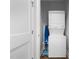 A laundry closet with a stacked washer/dryer unit and an ironing board at 212 Orange St, Oxford, NC 27565