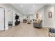 Bright living room with wood floors, modern furnishings, and access to the dining area at 212 Orange St, Oxford, NC 27565