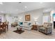 An expansive living room with hardwood floors, modern furniture, and lots of light at 212 Orange St, Oxford, NC 27565