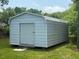 This is a durable and spacious storage shed on a well maintained lawn at 212 Orange St, Oxford, NC 27565
