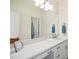 Elegant bathroom featuring a double vanity, quartz countertop, and large mirror for a bright and spacious feel at 220 Lakecroft Pl, Fuquay Varina, NC 27526