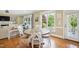 Bright and airy dining room features a wooden table set, hardwood floors, and natural light throughout at 220 Lakecroft Pl, Fuquay Varina, NC 27526