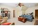 A spacious living room with a blue sofa, wooden coffee table, and built-in shelving showcases a comfortable and inviting space at 220 Lakecroft Pl, Fuquay Varina, NC 27526